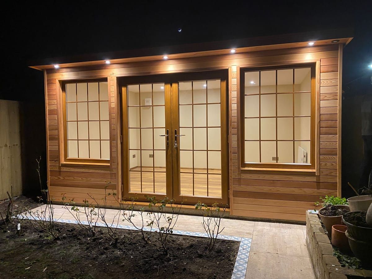 Cedar-clad bespoke garden room at night